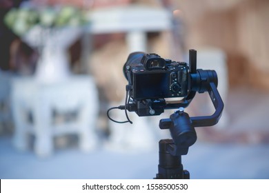 Photographers who are recording video at weddings are closely interested in photography. (Vintage style) - Shutterstock ID 1558500530