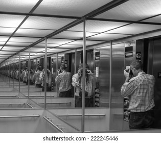 Photographing The Mirror. Multiple Man Reflections.