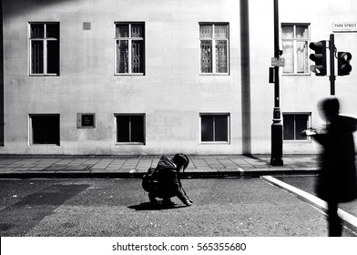 Photographs Of London At Night. Empty Street With Person Ducking