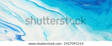 photography of abstract marbleized effect background. blue and white creative colors. Beautiful paint. banner