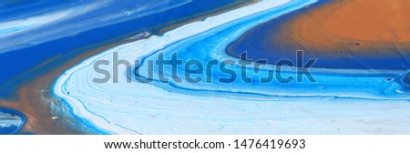 photography of abstract marbleized effect background. Blue, mint and white creative colors. Beautiful paint. banner