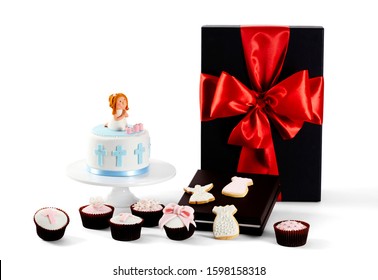 Photography Of Baby Christening Or First Communion (Catholic) Gift Hamper With Present, Cupcakes And Cookies On White Background