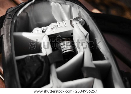 photography backpack with a small compact camera .  travel photographer concept