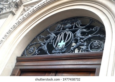 Photography of a banderole ornate with an artistic iron fence over a door in a public building of a ministry at Montevideo, Uruguay