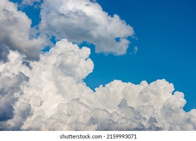 Photography Of Beautiful Storm Clouds, Cumulus Clouds Or Cumulonimbus Against A Clear Blue Sky. Full Frame, Sky Only.