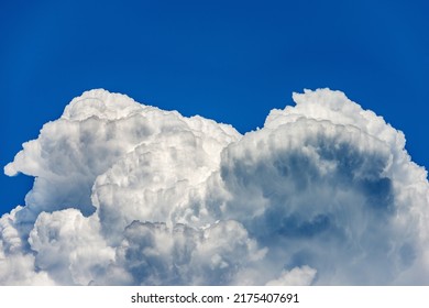 Photography Of Beautiful Storm Clouds, Cumulus Clouds Or Cumulonimbus Against A Clear Blue Sky. Full Frame, Sky Only.