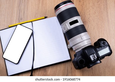 Photography courses on mock up white empty space smartphone screen. Web class, tutorials for photographers, notebook notice, school or workshop. Photo camera with lenses background. High quality photo