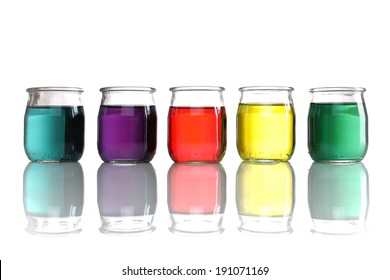 photography glass jars of colored water stacked on white background - Powered by Shutterstock