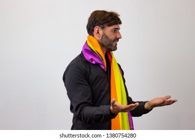 Photography Of A Handsome Young Man With Gay Pride Movement LGBT Rainbow Flag Holding Up Three Fingers, Facing Forwards And Looking At The Side