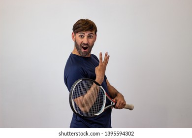 Photography Of A Handsome Young Man Playing Tennis Holding Up Six Fingers, Their Back Facing The Camera And Looking At The Camera