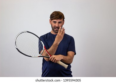 Photography Of A Handsome Young Man Playing Tennis Holding Up Six Fingers, Looking At The Camera