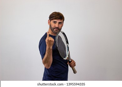 Photography Of A Handsome Young Man Playing Tennis Holding Up Three Fingers, Their Back Facing The Camera And Looking At The Camera