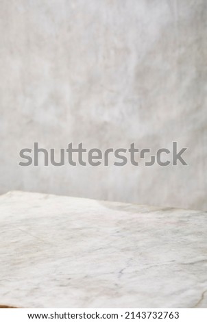 Photography of a light grey and white marble surface for food photography or similar. Low angled view.