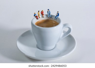 Photography of miniature people and toy figures, a group of people sits on a coffee cup for a break - Powered by Shutterstock