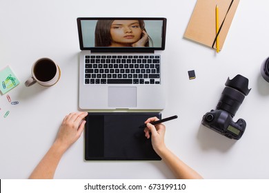 Photography, People And Design Concept - Hands With Graphic Tablet Retouching Photo On Laptop Computer And Camera At Table