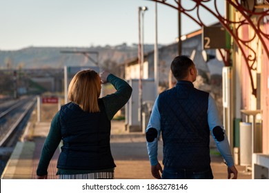 Photography Of A Person Waiting For A Subway. Closeup Shot Of Woman Feet Standing On Tiptoe While Embracing Her Man At Railway Platform For A Farewell Before Train Departure. Train Station