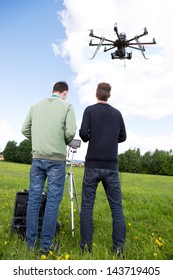 Photography RC Multirotor Helicopter Operated By A Photographer And Pilot