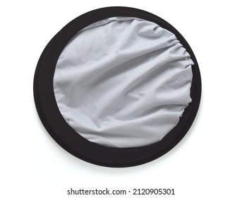 A photography reflector. A white reflector gives a soft natural look and is one of the most popular choices for reflecting light.