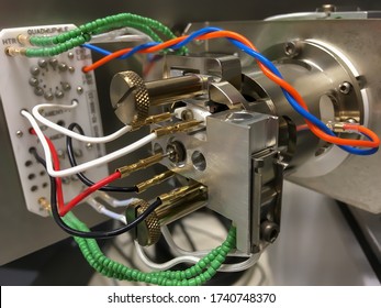 A Photography Showing An Opened Mass Spectrometer And An Ion Source Assembly. Selected Focus.