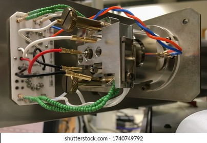 A Photography Showing An Opened Mass Spectrometer And An Ion Source Assembly. Selected Focus.