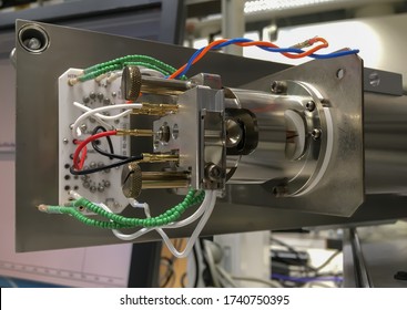 A Photography Showing An Opened Mass Spectrometer And An Ion Source Assembly. Selected Focus.