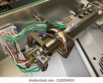 A photography showing an opened mass spectrometer and an ion source assembly. Selected focus. - Shutterstock ID 2120294555