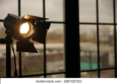 Photography Studio On Window Background With Lamp. Professional Lighting Equipment For Video Production. Constant Light