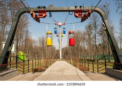 Photography to theme beautiful cabins of chairlift on autumn pine forest background, photo consisting of vacant cabins of chairlift in autumn forest, design cabins of chairlift in autumn dense forest