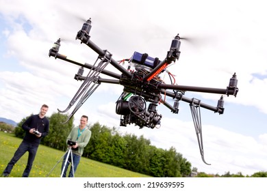 Photography UAV Being Operated By Pilot And Photographer