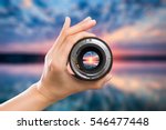 photography view camera photographer lens lense through video photo digital glass hand blurred focus people sun sunset sunrise cloud sky water lake concept - stock image