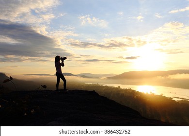 Photography woman with sunrise - Shutterstock ID 386432752