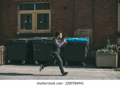 Photojournalist Running With Camera In Hand