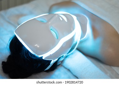 Photon Mask. Health And Beauty. Cosmetic Procedure For Woman Face. Beauty Laboratory. LED Facial Mask, Photon Therapy. Photo Shows The Different Modes, Colors