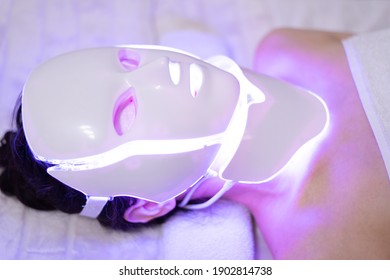 photon mask. Health and beauty. Cosmetic procedure for woman face. Beauty laboratory. LED Facial Mask, Photon Therapy. Photo shows the different modes, colors