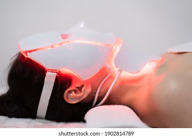 Photon Mask. Health And Beauty. Cosmetic Procedure For Woman Face. Beauty Laboratory. LED Facial Mask, Photon Therapy. Photo Shows The Different Modes, Colors