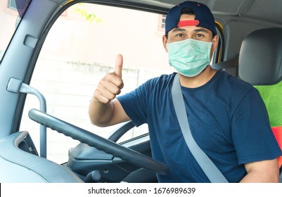  Photos Of Asian Truck Drivers Wearing Masks To Protect Against Dust And The Spread Of COVID 19 In Front Of The Car. Safety Ideas For A Worker In The Transportation Business. And Is A New Normal Life.