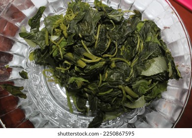 Photos of boiled spinach vegetable food dishes, in a dish container, taken from a close-up angle - Shutterstock ID 2250867595