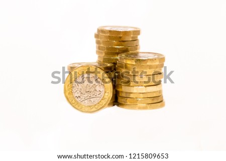 Photos of Golden Stacks of GBP Coins on white background with empty space