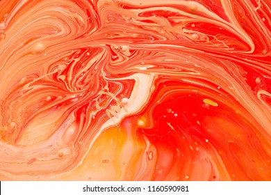 Photos Of Manufacturing A Paint Composite Color. Mixing Acrylic Paint In Different Colors. Marbleized.