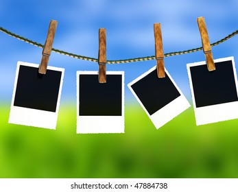 Photos On A Clothes Line Against A Green Field