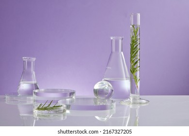 Photoshoot on laboratory doing research on green leaf , glassware beaker liquid in test tube and transparent podium with blank space for experiment development advertising