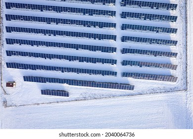 Photovoltaic Farm On Snowy Field. Alternative Energy In Poland, Europe