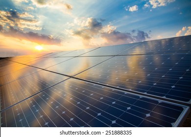 Photovoltaic modules on the background of sunset and cloudy sky - Shutterstock ID 251888335