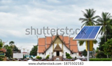 Photovoltaic panel installed infront of Wat Phumin Temple, Nan, Thailand. Concept for using grean and clean energy everywhere in the world to ruduce global warming and air pollution.