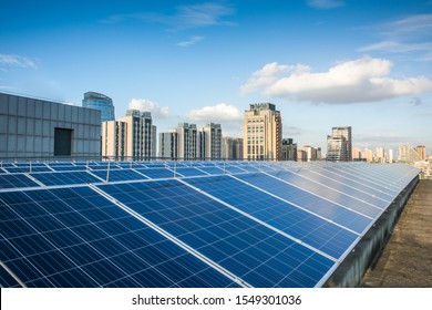 Photovoltaic Panels In Front Of City Background