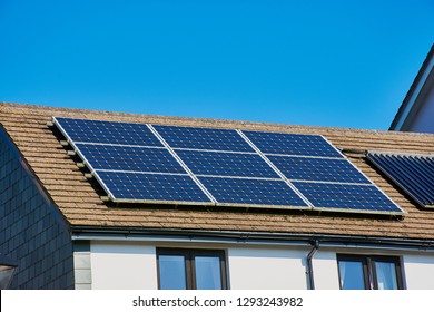 Photovoltaic Power Plant On The Roof Of A Cornish House On A Sunny Day - Solar Energy Concept Of Sustainable Resources