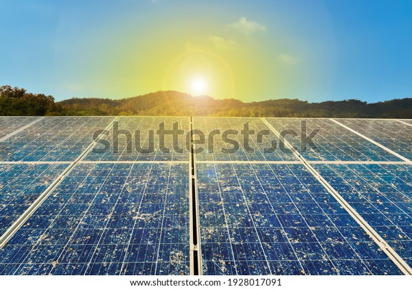 Photovoltaic roof on the house which had dust and\
birds\' droppings on the surface. It waited to be cleaned by the\
company or house\'s owner. Increasing efficiency concept. Selective\
and soft focus.
