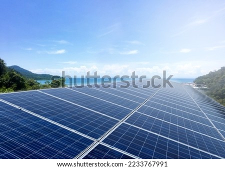 Photovoltaic rooftop installed on the building roof of the hotel in island to store and use the power from the sunlight, soft and selective focus, sustainable and eco energy in daily life concept.