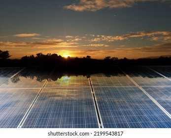 Photovoltaic Or Solar Panels Installed On The Rooftop Of The Building To Store And Use The Power From The Sunlight Within The House, Buildings And Apartment Nearby, Soft And Selective Focus.