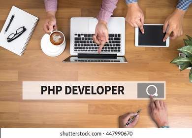 PHP DEVELOPER Man Touch Bar Search And Two Businessman Working At Office Desk And Using A Digital Touch Screen Tablet And Use Computer, Top View